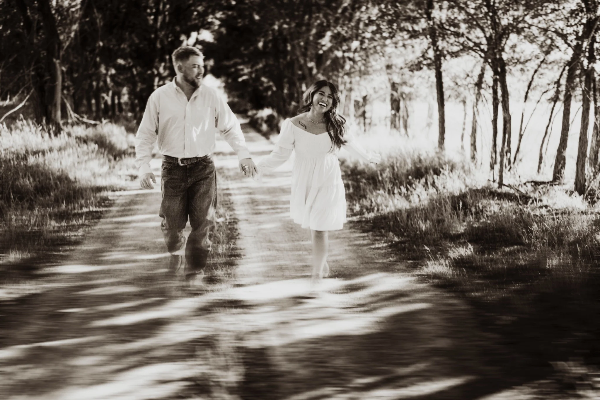 A couple walking together in dappled light