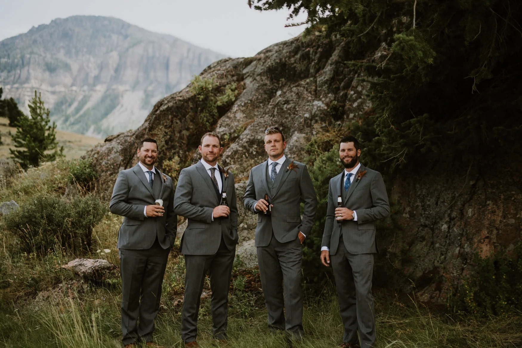 Groomsmen in the mountain landscape