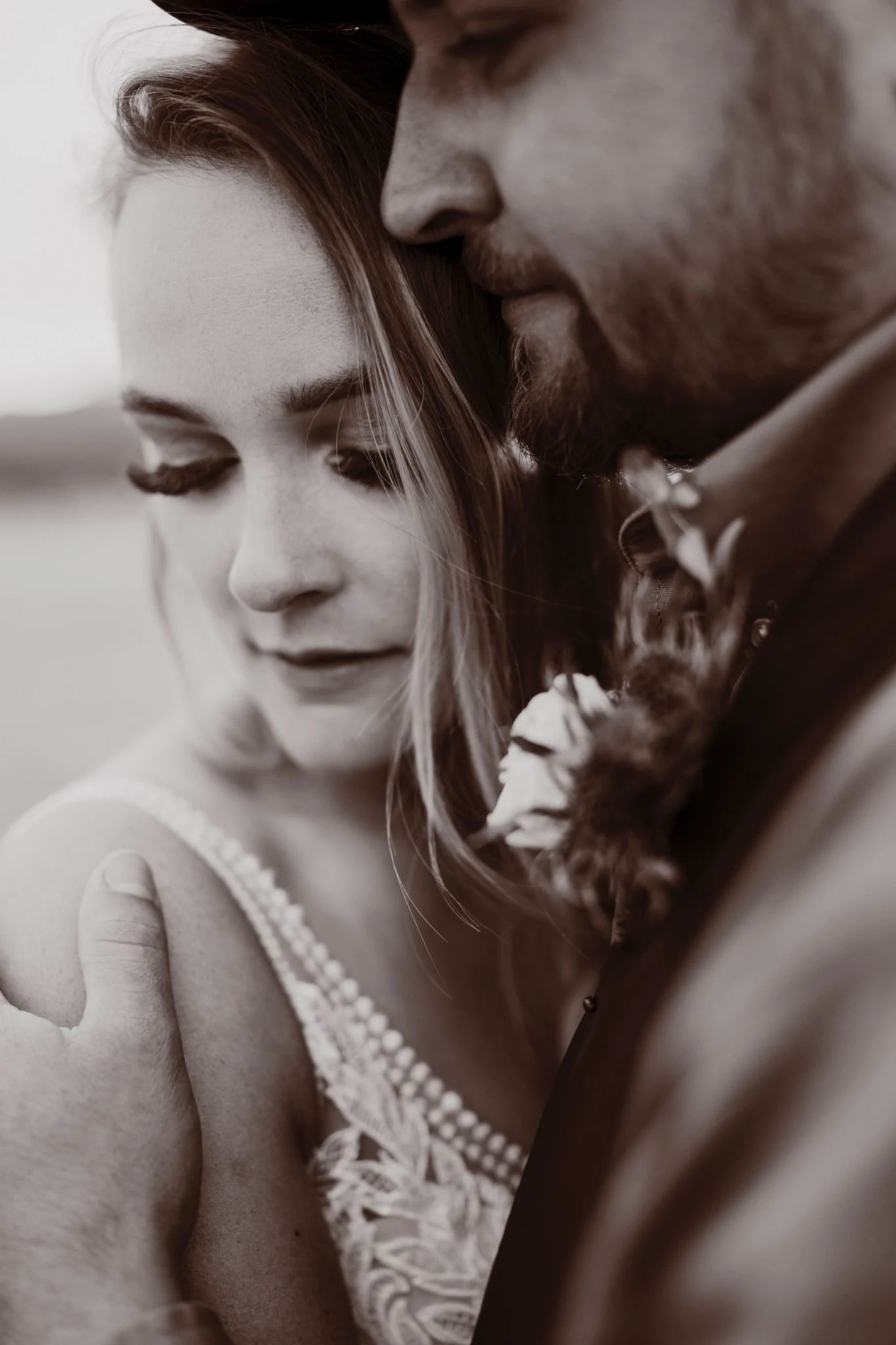 Intimate monochrome close-up of bride and groom